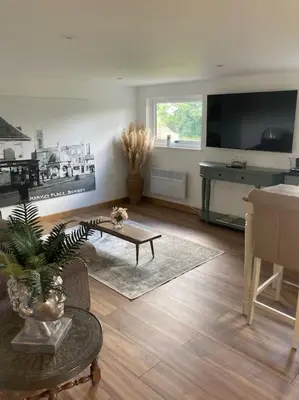 a living room with a couch and a table at Wood Lodge in Bungay