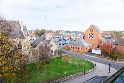 a view of a town with a church and a street at Contractor's Haven 4BED 2BATH House in Ipswich with FREE Parking in Ipswich
