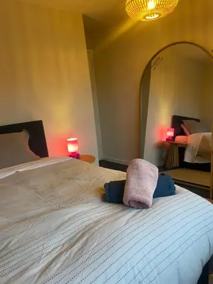 a bedroom with a bed with two towels on it at relaxed and peaceful #2 in St Ives