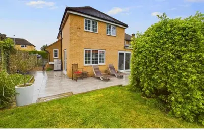 a brick house with a patio and a yard at relaxed and peaceful #2 in St Ives