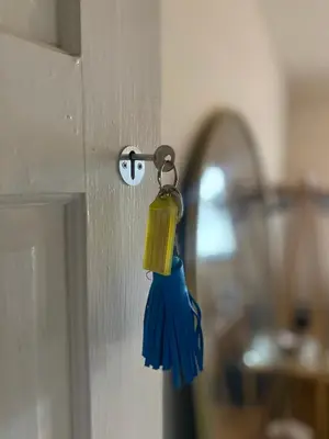 a yellow and blue object hanging from a door knob at relaxed and peaceful #2 in St Ives