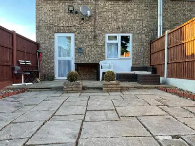 a patio in front of a brick building at Single Room Near Basildon City Centre in Basildon