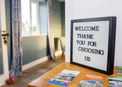 a sign that says welcome thank you for choosing us on a table at 4x Bed Luxurious Home With a View in Downham Market