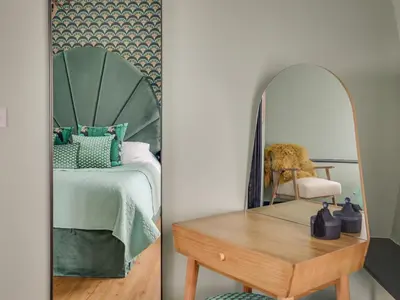 two pictures of a bedroom with a bed and a mirror at The Nissen Hut in Laxfield