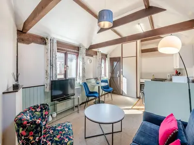 a living room with a couch and a table at Robin - Uk48171 in Colchester