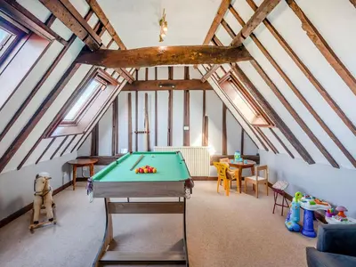 a room with a pool table in a attic at Robin - Uk48171 in Colchester