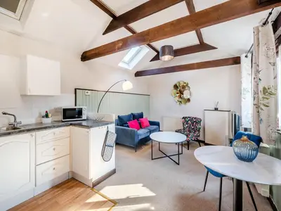 a kitchen and living room with a couch and a table at Robin - Uk48171 in Colchester