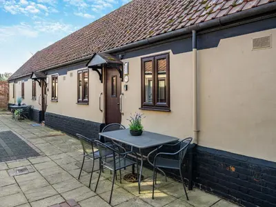a table and chairs in front of a house at Partridge - Uk48173 in Colchester