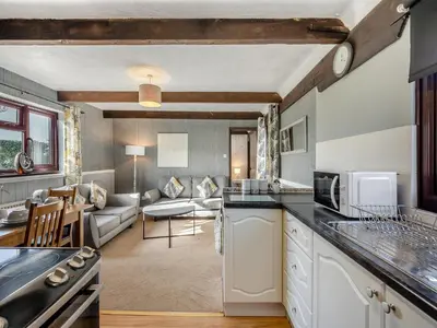 a kitchen and a living room with a couch at Partridge - Uk48173 in Colchester
