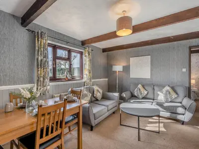 a living room with a couch and a table at Partridge - Uk48173 in Colchester