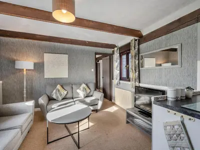 a living room with a couch and a table at Partridge - Uk48173 in Colchester