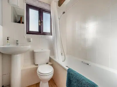 a white bathroom with a toilet and a sink at Partridge - Uk48173 in Colchester