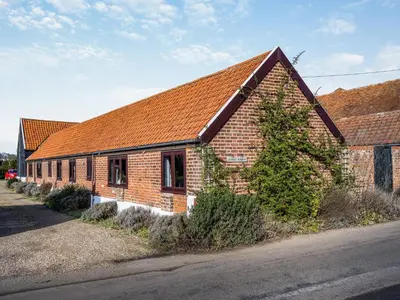 a brick building with an orange roof on a street at Partridge - Uk48173 in Colchester
