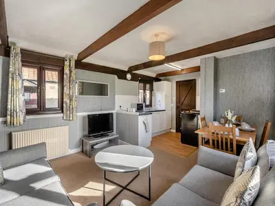 a living room with a couch and a table at Partridge - Uk48173 in Colchester