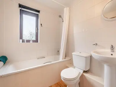 a white bathroom with a toilet and a sink at Plover - Uk48174 in Colchester