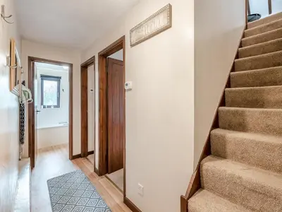 a hallway with stairs in a house at Plover - Uk48174 in Colchester