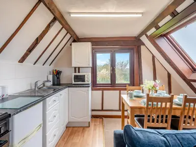 a kitchen and dining room with a table and chairs at Plover - Uk48174 in Colchester