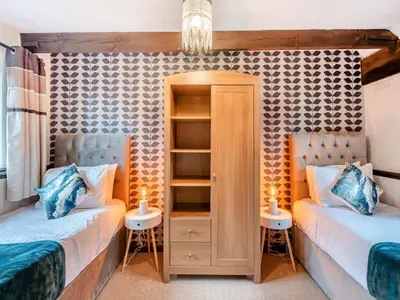 two beds in a room with two twin beds at Swallow - Uk48172 in Colchester