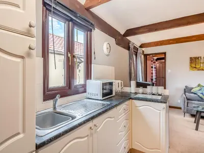 a kitchen with a sink and a microwave at Swallow - Uk48172 in Colchester