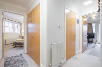 a hallway with a door leading to a bedroom at Fabulous Central 3Bed Apt - With Parking in Cambridge