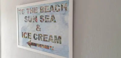 a picture of a poster hanging on a wall at Rainbow on Sea Frinton-on-Sea in Kirby Cross