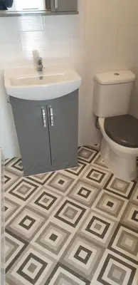 a bathroom with a sink and a toilet at Rainbow on Sea Frinton-on-Sea in Kirby Cross