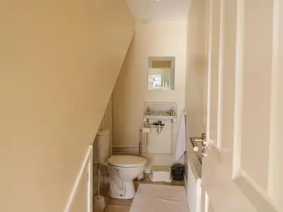 a bathroom with a toilet and a sink at 25 Resbury Close in Cambridge