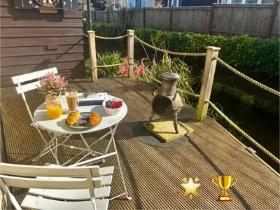 a table with fruit and juice on a deck at Little Brook Retreat in Chelmsford