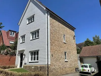 a white car parked in front of a brick building at 4br 2bath Home In Colchester Perfect For Big Group in Mile End