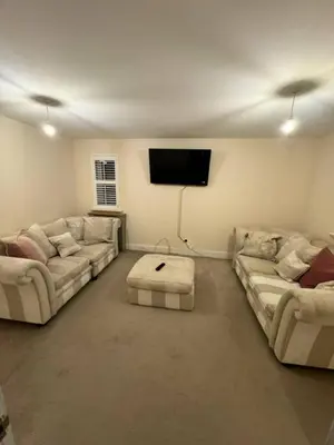 a living room with two couches and a flat screen tv at 4br 2bath Home In Colchester Perfect For Big Group in Mile End