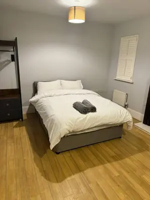 a bedroom with a bed with a towel on it at 4br 2bath Home In Colchester Perfect For Big Group in Mile End