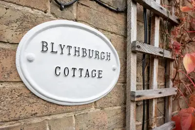 a sign on a brick wall with the words bubblebuck coffee at Blythburgh Cottage, Yoxford in Yoxford