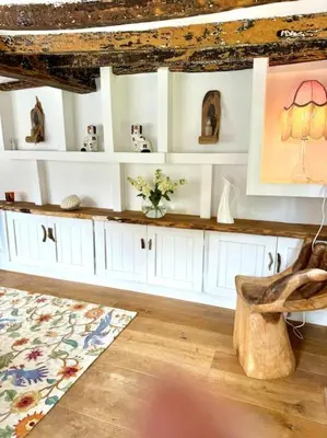 a room with white cabinets and a chair and a rug at Perfect country cottage retreat! in Fyfield