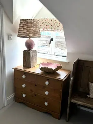a table with a lamp on top of a dresser at Perfect country cottage retreat! in Fyfield