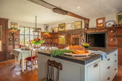 a kitchen with a counter with vegetables on it at Spectacular thousand year old Medieval manor house - Flemings Hall in Ipswich
