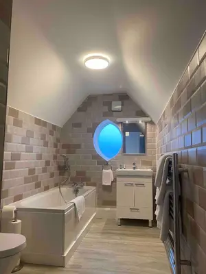 a bathroom with a tub and a blue balloon at Dream Yard Apartments Westcliff in Southend-on-Sea