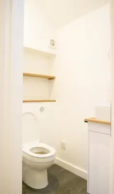 a bathroom with a white toilet in a room at Spacious Suffolk base in Saxmundham