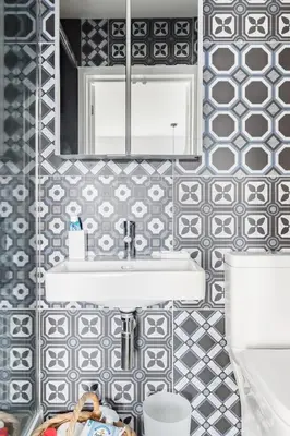 a bathroom with a sink and a mirror at Meadow Cottage in Trumpington