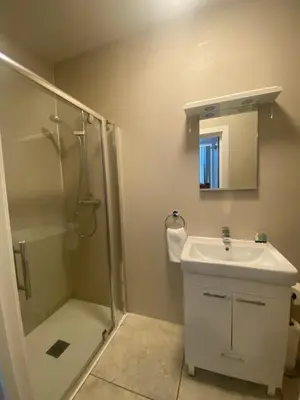 a bathroom with a shower and a sink at Dream Yard Apartments in Southend-on-Sea