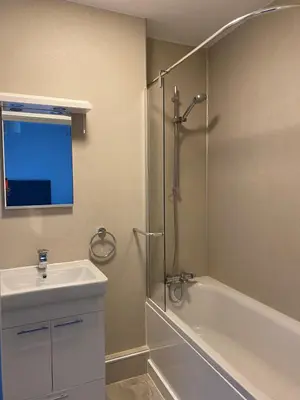 a bathroom with a shower and a sink and a tub at Dream Yard Apartments in Southend-on-Sea