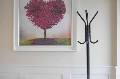 a picture of a tree on a wall at Kestrel Gardens Five Bedroom Homes in Great Dunmow