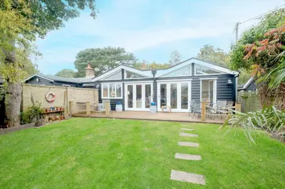 a house with a garden in front of it at 3 Uplands, Thorpeness - Sleeps 3, Close to Beach, Boating Lake, Thorpeness Golf Club and Country Club - Aldeburgh Coastal Cottages in Thorpeness