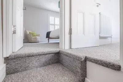 a hallway with a door leading to a bedroom at Beautiful 2Bed cottage nr City in Cambridge