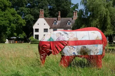 an elephant statue in a field in front of a house at Hill House Norfolk in Saxlingham Nethergate