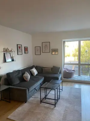 a living room with a couch and a table at Luxurious City Centre Cosy WiFi and Netflix in Chesterton