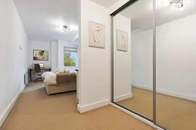 a bedroom with a mirror and a bed in a room at Luxurious City Centre Cosy WiFi and Netflix in Chesterton