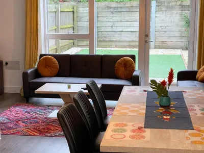 a living room with a couch and a table at Central Luxury Peaceful Home With Driveway Parking - Cambridge Homehost in Cambridge