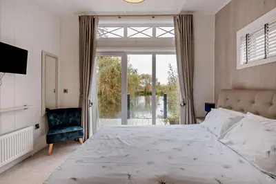 a bedroom with a large bed and a window at 2 Bed in Welney oc-k30123 in Welney