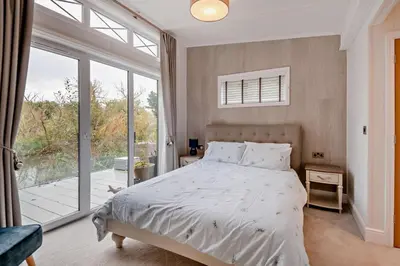 a bedroom with a bed and a large window at 2 Bed in Welney oc-k30123 in Welney