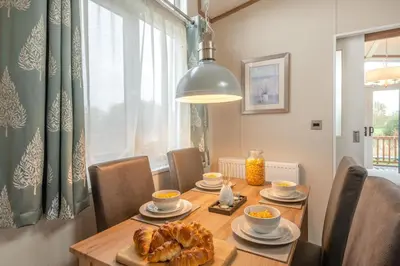 a dining room with a table with food on it at 2 Bed in Welney oc-c30124 in Welney